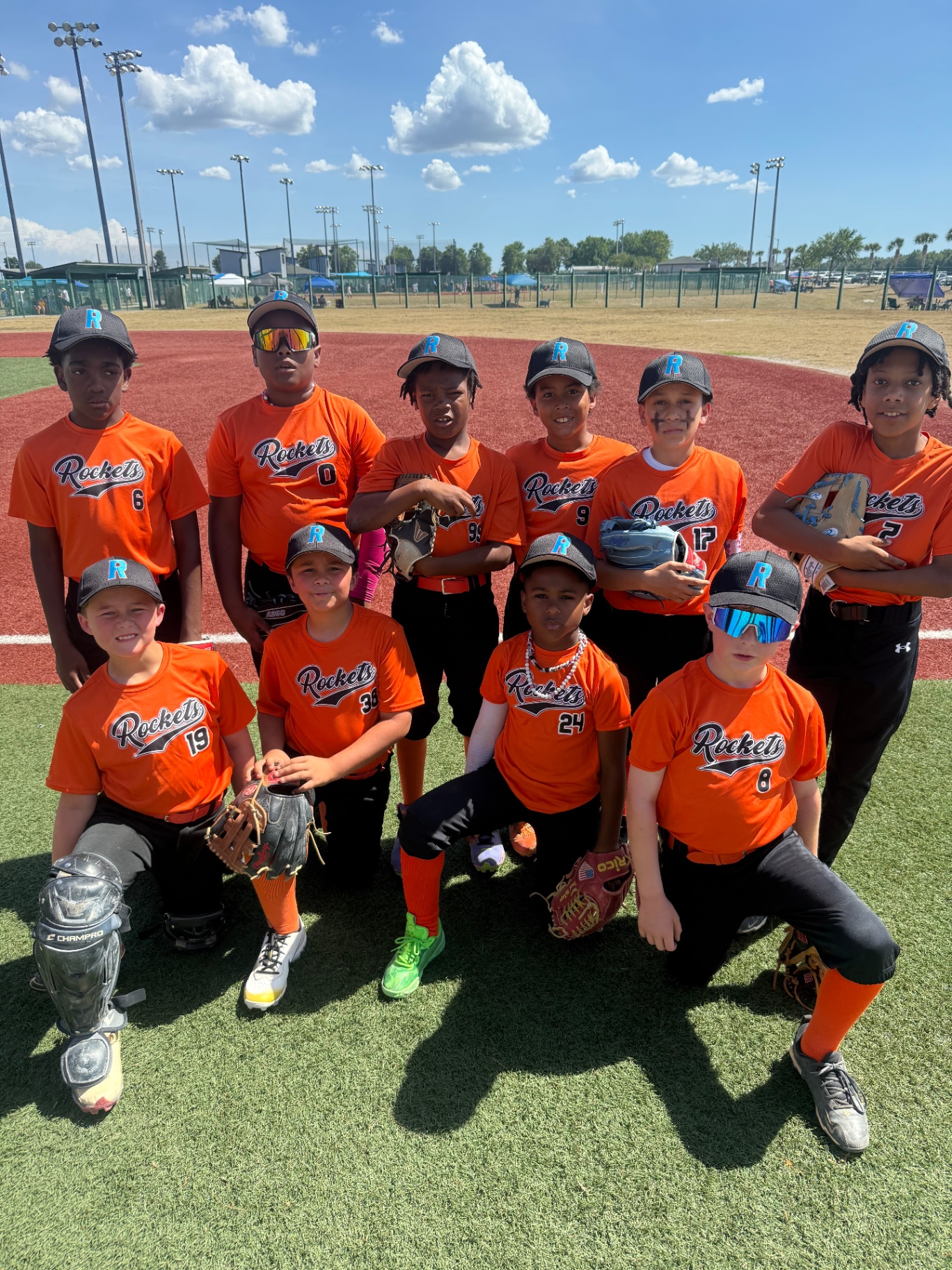 Rockets players in orange uniforms on the field