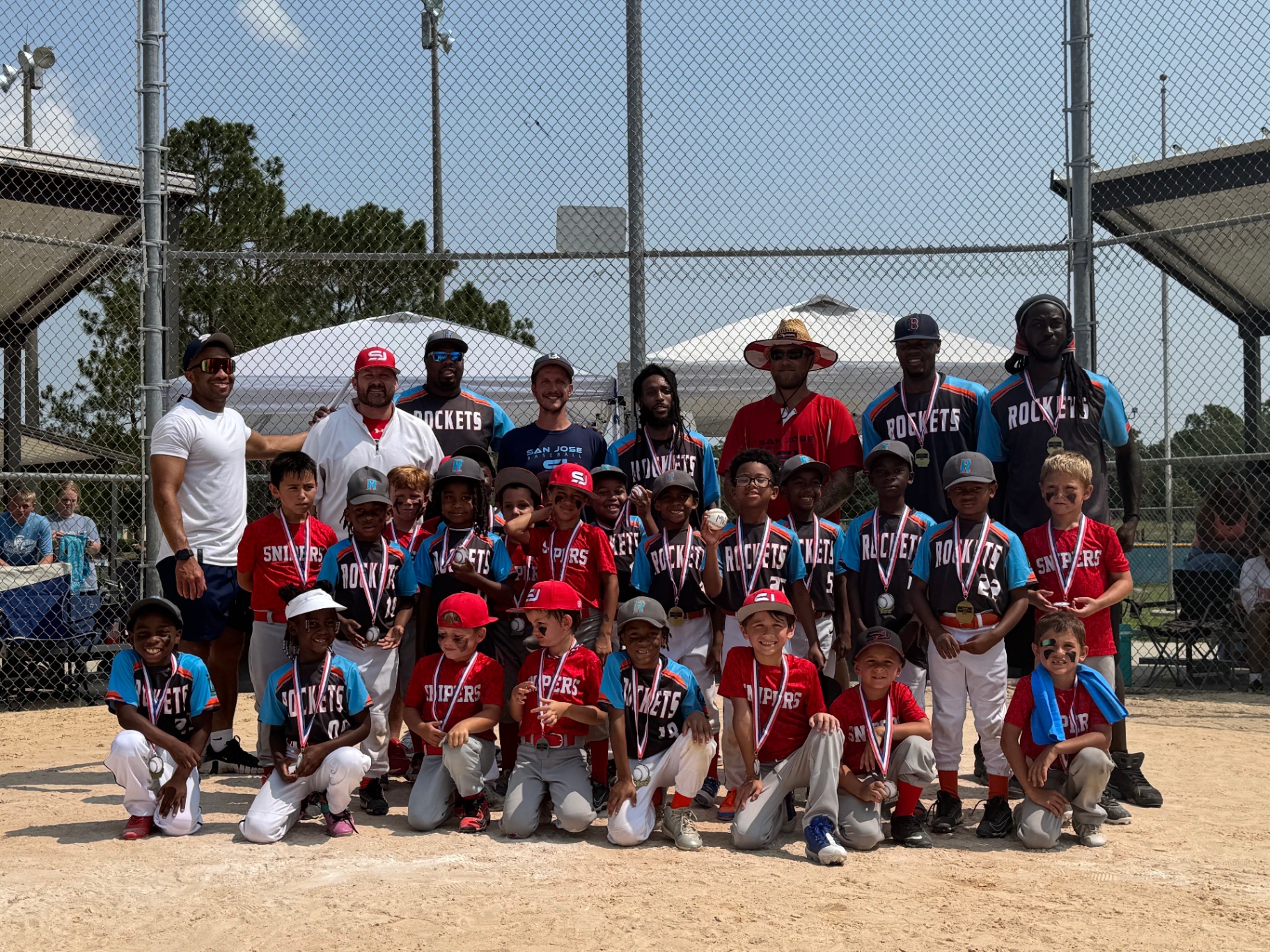 Youth team with medals and coaches