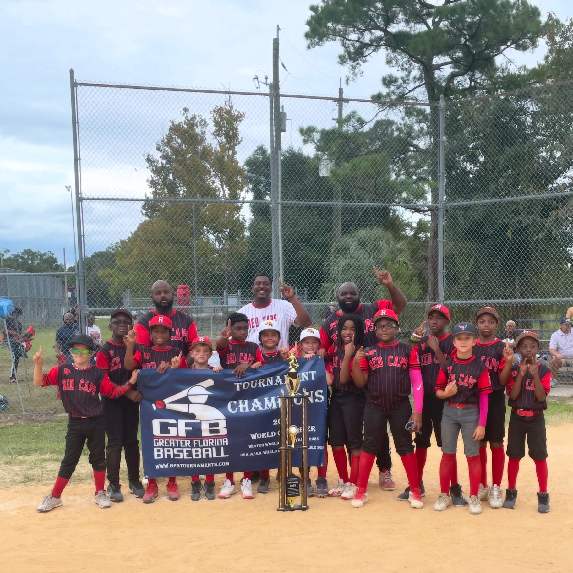 Redcaps team with tournament championship banner